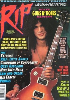 a magazine cover with an image of a man holding a guitar