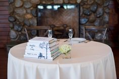 the table is set with books and glasses