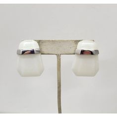 1980s Modernist geometric rhodium plated white Lucite pierced push back earrings. Marked "TRIFARI©" and "Kunio Matsumoto" both in script. Measure: 1 3/8 inches long by 1 inch wide.   Excellent condition. Identical earrings were featured in an advertisement, year unknown. Modern White Earrings For Formal Occasions, Modern White Clip-on Earrings, Modern White Gold Clip-on Earrings For Formal Occasions, Modern White Clip-on Jewelry, Retro White Earrings For Formal Occasions, White Retro Earrings For Formal Occasions, White Retro Formal Earrings, Abstract Earrings, Van Cleef And Arpels