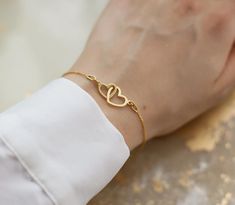 Gold Interlocking Heart Bracelet, Infinity Love Bracelet, Girlfriend Gift, Mum Birthday Gift, 24k Gold Vermeil, Gift For Her A stunning piece of jewelry in a beautiful box. The bracelet features interlocking heart charm & a beautiful pearl heart at the end of the extension chain.  f e a t u r e s ∙ interlocking hearts symbolising infinite love  ∙ 24ct gold vermeil (with 925 sterling silver base) ∙ add a complimentary gift message for free ∙ minimal design ∙ nickel free ∙ adjustable size (7" - 8. Mother's Day Double Heart Friendship Bracelet, Elegant Heart Shaped Bracelets For Anniversary, Valentine's Day Friendship Name Bracelet, Minimalist Double Heart Bracelets As Gift, Double Heart Bracelet Valentine's Day Gift, Minimalist Double Heart Bracelet As Gift, Minimalist Double Heart Bracelet For Gift, Minimalist Double Heart Bracelet Gift, Mother's Day Bracelet Jewelry For Anniversary Gift