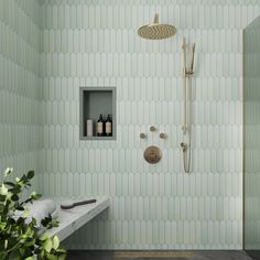 a bathroom with green walls and white tile on the shower wall, along with an open shelf for personal care items