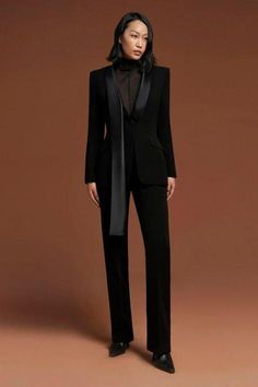 The blazer with unique lines and designs will contribute to exalting the glamorous and elegance. Luxury Long Sleeve Formal Pantsuit, Luxury Long Sleeve Tuxedo For Office, Elegant Fall Pantsuit For Formal Occasions, Evening Blazer With Lapel Collar And Hidden Buttons, Evening Blazer With Single Breasted Notch Lapel, Fall Office Single-breasted Tuxedo, Fall Office Tuxedo, Single Breasted, Fall Single Breasted Tuxedo For Office, Elegant Black Pantsuit For Semi-formal Occasions