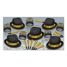 a group of hats and wands on top of a white table with gold decorations