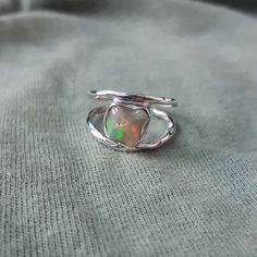 925 Solid Silver Opal Ring, Natural Genuine Uncut Ethiopian Opal Ring, Raw Opal Ring, Opal Birthstone Ring, Gift Ring, Gift For Anniversary, Gemstone:  Natural Raw Ethiopian Opal Metal Purity :- Solid 925 Sterling Silver Stone Shape: Rough  Weight:-   3.5 gm (Approx) Ring Size :- All US Sizes Available This Item Have 925 Stamp Made In: Jaipur, India _._._._._._._._._._._._._._._._._._ DELIVERY TIME:-) Item usually gets delivered within 7 to 15 days, depending on the country and location. _._._._._._._._._._._._._._._._._._ PAYMENT POLICY:-) We accept payment through PayPal only. _._._._._._._._._._._._._._._._._._ FEEDBACK:-) If you like the item and satisfied with our service, once you purchased it, please give us a five stars review. Others should also know that we are giving are best. A Handmade Opal Toe Ring As Gift, Handmade Opal Open Ring For Gift, Handmade Opal Open Ring Gift, Handmade Open Opal Ring For Gift, Handmade Spiritual Open Opal Ring, Handmade Sterling Silver Opal Promise Ring, Silver Hand Wrapped Ring, Silver Hand Wrapped Toe Ring, Handmade Sterling Silver Toe Ring