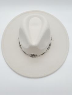 Carry your spirit with you wherever you go when you wear this fedora hat. A playful chain detail and flat brim make it easy to pair with any outfit, while an adjustable strap inside ensures that it fits perfectly. Made of felt, this hat is both practical and stylish! Fedora hat Chain strap detail Flat brim Adjustable inside One size fits most Felt material Crown height 4.5" Brim 3.5" Hat Chain, Felt Material, Fedora Hat, Free Spirit, Chain Strap, Fedora, Cowboy Hats, Felt, Crown