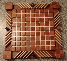 a wooden puzzle sitting on top of a floor