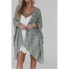 Elevate your wardrobe with the ultimate boho kimono! Designed in a lightweight, textured sage fabric and adorned with playful pom-pom details, this kimono effortlessly adds a touch of bohemian charm to any outfit. With an open front, poncho armhole sleeves, and side slits, it's the perfect combination of style and comfort. Embrace your free-spirited nature with the Bali Embroidered Kimono. Approximate measurements are as follows: OS: 45" x 31" One Size Fits Most *Due to lighting and differences Spring Beach Outerwear With Boho Print, Boho Print Outerwear For Beach In Spring, Spring Boho Print Outerwear For Beach, Boho Print Outerwear For Spring Beach, Bohemian Spring Outerwear With Fringe, Bohemian Long Sleeve Fringe Cover-up, Spring Beach Cardigan With Fringe, Fall Beach Kimono With Tassels, Bohemian Long Sleeve Kimono With Fringe