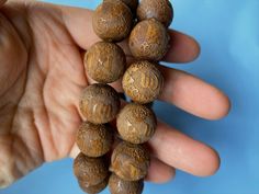 Material: Natural Sandalwood (Natural Wood, Fragrance Free ) Size: 16 mm Hole: 1.5 mm QTY: 14-15 beads Traditional Beaded Bracelets With Round Beads For Blessing, Wooden Beads For Jewelry Making, Handmade Round Beads Mala For Blessing, Handmade Mala With Round Beads For Blessing, Wooden Round Beads For Jewelry Making, Round Wooden Beads For Jewelry Making, Traditional Round Wooden Beaded Bracelets, Brown 8mm Round Beads, Brown 8mm Beads