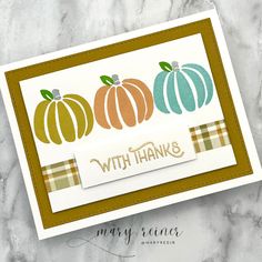 a card with three pumpkins on it and the words, with thanks written in gold