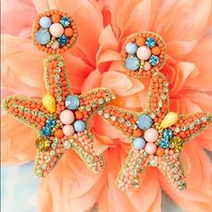 Coral Seed Bead Starfish Earrings Coral Earrings For Summer Beach Occasion, Summer Beaded Starfish Jewelry, Coral Earrings For Beach Summer, Coral Earrings For Beach And Summer, Summer Beach Coral Earrings, Handmade Starfish Earrings For Summer, Multicolor Starfish Shaped Jewelry For Vacation, Multicolor Starfish Jewelry For Vacation, Ocean-inspired Star Earrings For Summer