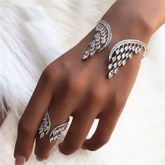 These angel wing bracelets with cubic zirconia are a must-have for any jewelry lover looking... Angel Wing Bracelet, Bangle Designs, Mua Sắm, Jewelry Lover, Modern Jewelry, Angel Wings, Ring Bracelet, Luxury Jewelry, Bracelet Set