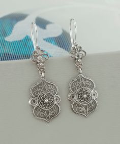 Handmade Silver Daisy Flower Women Drop Earrings, 925 Sterling Silver Floral Filigree Dangle Earrings, Vintage Delicate Ornate Earrings Statement earrings, ottoman earrings, anniversary gift her, greek earrings, tiny dangle earrings, dainty earrings Earrings' Length : 4.5 ( 1.8 in )   Width : 2cm ( 0.8 in ) These handmade silver filigree Art Floral Dangle Earrings, 925 Sterling Silver Daisy Flower Women Drop Earrings are a stunning piece of jewelry for the contemporary woman. These delicate and Classic Filigree Chandelier Earrings For Gift, Sterling Silver Filigree Dangle Chandelier Earrings, Sterling Silver Chandelier Earrings With Intricate Design, Sterling Silver Chandelier Earrings With Intricate Design For Gift, Sterling Silver Filigree Chandelier Earrings, Silver Filigree Chandelier Earrings For Anniversary, Sterling Silver Filigree Chandelier Earrings For Formal Occasions, Sterling Silver Filigree Chandelier Earrings For Formal Events, Classic Filigree Chandelier Earrings As Gift