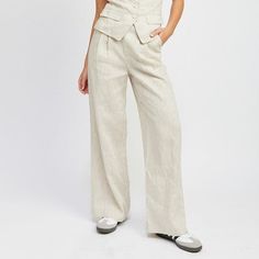 Discover effortless elegance with our Linen Pleated Pants, crafted from 100% linen for an ultra-breathable and lightweight feel. These pants feature a timeless pleated design, adding a touch of sophistication to any look while maintaining a relaxed vibe. Whether you're dressing up for the office or down for a casual day out, these versatile pants will keep you cool and stylish throughout the seasons. Material & Care: Material: Self: 100% Linen / Lining: 100% Cotton Available in: S-M-L Model wear Tailored Linen Wide Leg Pants For Business Casual, Solid Linen Pants With Welt Pockets, Elegant Linen Bottoms With Relaxed Fit, Tailored Beige Linen Pants, Tailored Linen Casual Pants, Elegant Relaxed Fit Linen Pants, Tailored Casual Linen Pants, Classic Linen Bottoms For Spring, Tailored Linen Long Pants