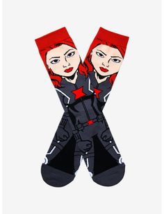 two women with red hair are wearing black and white socks that have the same design on them