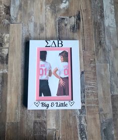 a photo frame with the words big & little on it and a woman's t - shirt