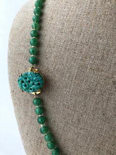 Item: Vintage 1930s Carved Faux Jade Peking Glass Beaded Necklace Possibly Czech. There is no signature or label.Measurements: 22 & 1/2 inches long. The largest round bead measures 11mm across.Condition: Very good, previously owned. There is no damage to note.Please see our other listings, we combine shipping for savings. Vintage Beaded Chain Necklaces, Vintage Jewelry With Round Faceted Beads, Retro Single Strand Round Bead Jewelry, Vintage Round Gemstone Beads Jewelry, Adjustable Vintage Jewelry With Polished Beads, Vintage Jewelry With Round Gemstone Beads, Retro Beaded Chain Jewelry With Round Beads, Vintage Round Jewelry With Faceted Beads, Vintage Jewelry With Oval Gemstone Beads