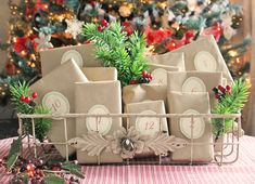 several wrapped presents are sitting in front of a christmas tree