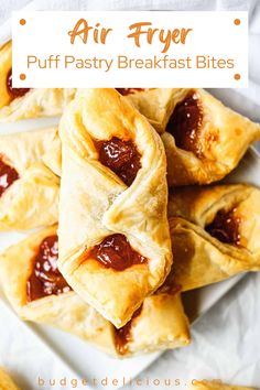 several pastries on a plate with ketchup in the middle