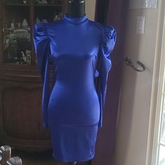 This Brand New Fashion Nova Gorgeous Royal Blue Dress Has Long Sleeves That Puff At The Top. The Neckline Is A Mock Turtleneck. It Has An Open Back And Ties In The Back And Is Slightly Stretchy. Blue Long Sleeve Puff Sleeve Dress For Brunch, Blue Long Sleeve Puff Sleeve Dress For Evening, Chic Blue Long Sleeve Puff Dress, Blue Puff Sleeve Knee-length Dress With Ruffles, Blue Long Sleeve Puff Sleeve Dress For Party, Blue Puff Sleeve Mini Dress For Night Out, Blue Puff Sleeve Dress For Date Night, Chic Blue Puff Sleeve Dress With Ruffles, Blue Fitted Ruched Puff Sleeve Dress