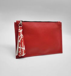 "Leather Clutch Pouch (Lady in Red) Handmade Leather Exterior - 9\" x 5.7\" unlined Interior Metal Zip Closure Suede Leather Zip Pull This solidly assembled pouch fits comfortably and stylishly in your hand or in another bag. Made of genuine leather with a gorgeous suede leather zipper pull... metal zip closure and a 7\" opening. Assembled with the minimalist in mind, the pouch comfortably holds a small card wallet, cell phone, car keys, and small makeup compact etc. Have One Made as a gift! It's All Natural! Scars, scratches and birthmarks remain prevalent in order to exhibit a truly, natural leather. Some photos may or may not depict these characteristics. Markings are accentuated in this leather and should be appreciated.  Items are photographed in indoor and outdoor light as an attempt Makeup Compact, Bags Patterns, Diy Bags Patterns, Diy Bags, Small Makeup, Outdoor Light, Clutch Pouch, Toiletry Storage, Small Cards