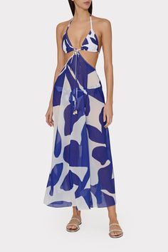 Done in a sheer version of our new-for-spring Grand Foliage print, this versatile cover-up is designed to be worn multiple ways: tied as a halter dress or as a bikini top style. It’s finished with tassel details on the ties. Wear it over its coordinating Grand Foliage print swimwear. Halter Neck Top For Beach Cover-up During Beach Season, Blue Halter Neck Beach Dress For Poolside, Blue Beach Dress For Summer Parties, Halter Neck Beach Cover-up For Spring, Spring Poolside Halter Neck Beach Dress, Blue Tie Back Halter Top For Beachwear, Blue Beachwear Halter Top With Tie Back, Halter Neck Beach Dress For Summer Parties, Chic Blue Swimwear For Beach Cover-up