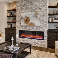 a living room with two couches and a fire place in the middle of it