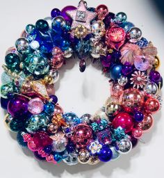 a wreath made out of ornaments on a table