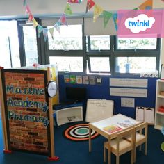 the children's playroom is decorated with colorful flags and bunting on the windows