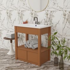 a bathroom with a sink, mirror and towels on the shelf in front of it