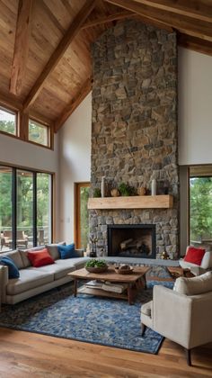 a living room filled with furniture and a fire place in the middle of a room