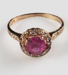 *This ring has more patina on the Rose Gold Plating. PLEASE study all photos carefully. *Size 6 (plated, not sizeable) *Weighs: 2.4 grams *Beautiful, genuine, deep raspberry colored Ruby surrounded by natural, rose cut diamonds. *This ruby does have visible natural characteristics up close, but the clarity & color of this stone is very good considering. *Approximately 1.25 ctw Ruby surrounded by 0.15 ctw diamonds that are color H & Clarity SI1-2. Some diamonds have visible inclusions but sparkle Vintage Diamond Ring With Halo Design, Vintage Halo Diamond Ring, Vintage Rose Gold Diamond Ring With Gemstone, Vintage Cluster Ring With Halo Design, Vintage Round Halo Design Jewelry, Vintage Hallmarked Rose Gold Diamond Ring, Vintage Halo Design Ring, Vintage Pink Diamond Ring Hallmarked, Vintage Halo Ring Jewelry