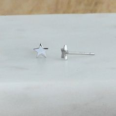 Tiny, plain minimalist star earrings! Perfect for a dainty look or on multiple piercings! ►► Details ▸ Measures 5mm x 5mm ▸ Made of 925 Sterling Silver plated in 14k Gold, 14k Rose Gold, or Rhodium ▸ We use a THICK plating for piece that will last you years to come ▸ Sold as a PAIR ▸ Push back closure ▸ Nickel-free ▸ Hypo-allergenic ✈️Ships outs SAME DAY for fast delivery. Domestic Orders are delivered at your doorstep in 2-3 days! 🎁Packaged in a white gift box, ready for gift-giving! If you ha Minimalist Star Earrings For Everyday, Diamond Star Earrings, Huggie Earrings Gold, Celestial Earrings, Earrings Star, Multiple Piercings, Star Stud Earrings, Minimalist Earrings Studs, Minimalist Studs