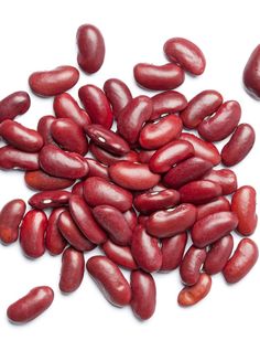 red beans are shown on a white surface