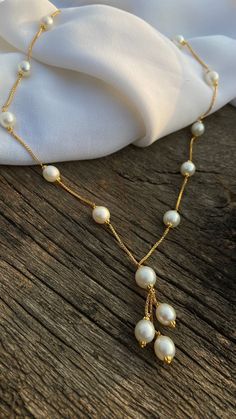 "18K Gold Choker Necklace, Dainty Pearl Chain Necklace, White South Sea Bead Necklace, Spaced Pearl Necklace, Valentine's Gift Product Details :- Gross Weight : 16.03 Gram Stone Weight : 60 CTS Pearl Size : 7-8 MM  Pearl Color : White  No. of Pearl : 16 \"Elevate your style with our Dainty Pearl 18K Choker Necklace. Delicately layered, this South Sea Spaced Bead Necklace in 18K gold is a timeless and elegant accessory, perfect for gifting on Valentine's Day.\"" Pearl Necklace With Round Beads And Chain, White Lariat Necklace With Beaded Chain, White Beaded Chain Lariat Necklace, Wedding Necklace With Round Beads And Chain, White Chain Necklace With Pearl Pendant And Round Beads, Pearl Necklace With Round Beads For Gift, Pearl Necklaces With Adjustable Chain And Round Beads, Pearl Necklace With Chain As Gift, Bridal Necklace With Pearl Pendant And Round Beads