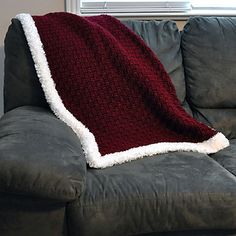 a couch with a blanket on top of it