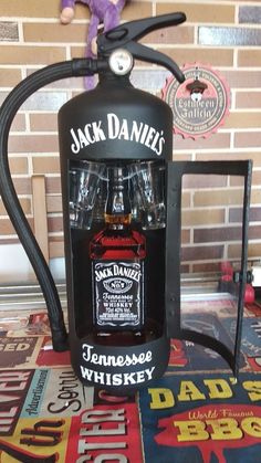 a jack daniels bottle with two glasses in it