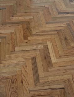 the floor is made up of wood and has very many different patterns on it's surface