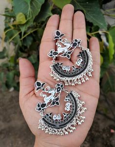 Add charm and charisma to your beautiful personality with these exquisitely handcrafted Afghani earrings made with high quality German Silver. The intricate design and the glass enamel work renders these earrings a very unique and classy look. Pair them up with any formal or casual attire and gather compliments all the way!Weight 25gmLength 2.8"Width 1.8" Oxidised Jewellery Earrings, Capsule Wardrobe Jewelry, Vintage Indian Jewelry, Beautiful Personality, Indian Wedding Jewelry Sets, Pretty Jewelry Necklaces, Junk Jewelry, Fancy Jewellery Designs, Indian Jewellery Design Earrings