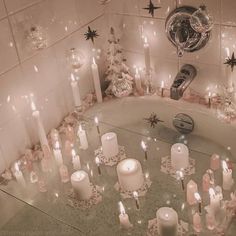 a bath tub filled with lots of candles