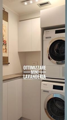 there is a washer and dryer in this small laundry room with white cabinets