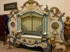 an ornately decorated bench in the middle of a room