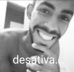 a black and white photo of a man smiling with the words desativa in front of him