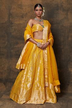 Yellow banarasi silk lehenga with woven zari floral jaal motifs. Comes with dupatta and unstitched blouse fabric. - Aza Fashions Cotton Silk Traditional Wear With Zari Weaving For Reception, Cotton Silk Lehenga For Diwali Reception, Cotton Silk Lehenga For Reception And Diwali, Silk Sets With Zari Weaving For Reception, Gold Cotton Silk Sharara With Pallu, Yellow Anarkali Lehenga In Cotton Silk, Tissue Silk Lehenga With Zari Weaving For Reception, Transitional Lehenga With Zari Work, Transitional Cotton Silk Lehenga With Zari Work