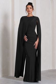 Defined by an extravagant asymmetric cape. Magdelena is a sophisticated option for your next black tie wedding or race day event. Crafted in our signature stretch jersey. this black maxi dress features a high neckline and gathered waist before falling into an elegant floor sweeping skirt. Features - Premium stretch jersey- High neckline - Asymmetric cape- Invisible zip closure - Gathered waist tucks- Maxi length Sizing & Fit Model is 5'8" and wears UK size 8 / US size 4 Product Information Desig Extravagant Modest Dresses, Asymmetric Cape, Black Tie Event Dresses, Black Tie Wedding Guest Dress, Abaya Outfit, Phd Graduation, Velvet Prom Dress, Black Tie Wedding Guests, Style Goals