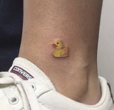 a small rubber ducky tattoo on the ankle