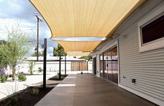 an outdoor covered walkway next to a building