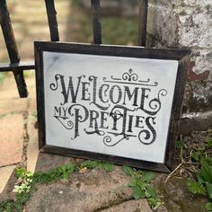 a sign that says welcome to my pretties on the side of a fence