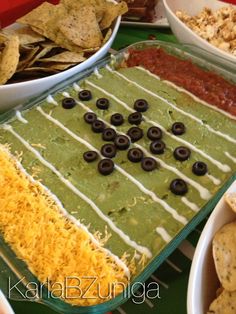 a football party food spread with chips and dip