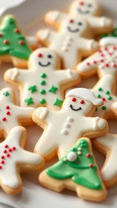 several decorated cookies on a white plate