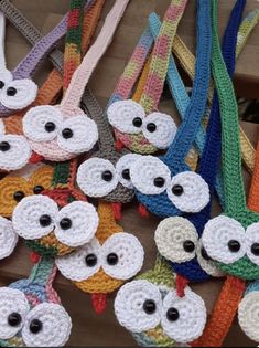 several crocheted owls are on display for sale